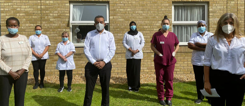 Socially distanced protest with healthcare workers wearing masks