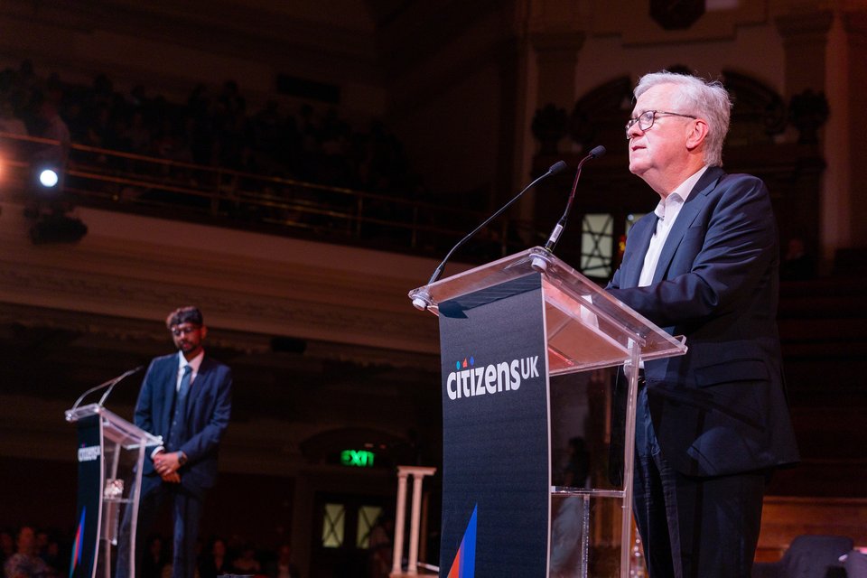 Lord Newby on stage at a Citizens UK Assembly