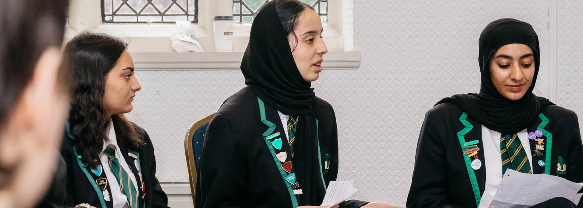School girls speaking in academic report meeting
