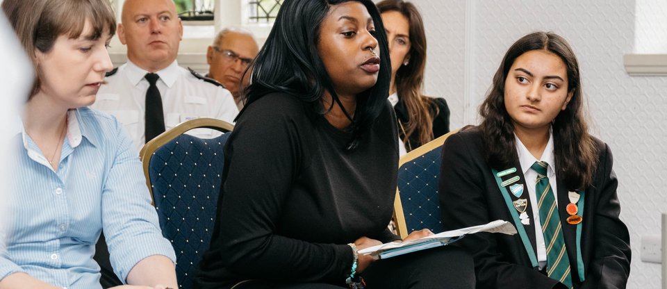 Women speaking during community discussion