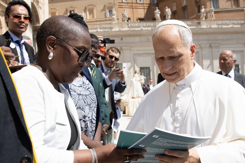 Pope Leo XIV receives a copy of the Community Organising & Catholic Social Teaching toolkit