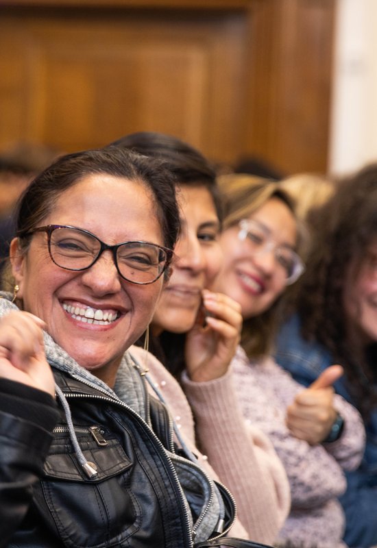 Headshot of person smiling during Citizens UK Living Wage for Social Care Assembly