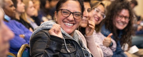 Headshot of person smiling during Citizens UK Living Wage for Social Care Assembly