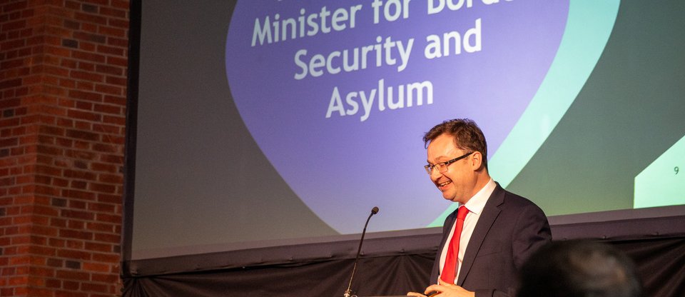 Minister Alex Norris speaks at Named Sponsorship Summit