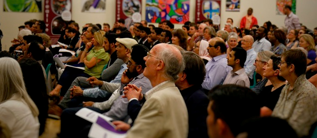 Group of people sitting at an assembly