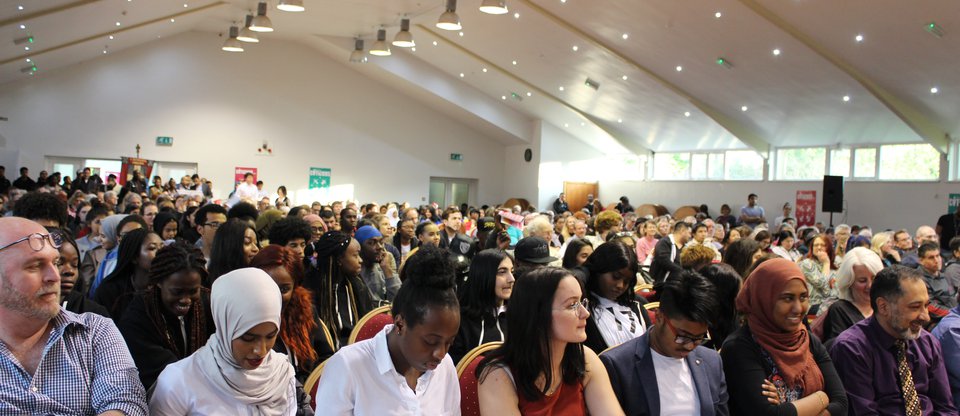 Waltham Forest gathering, a large audience of people is sitting in an assembly