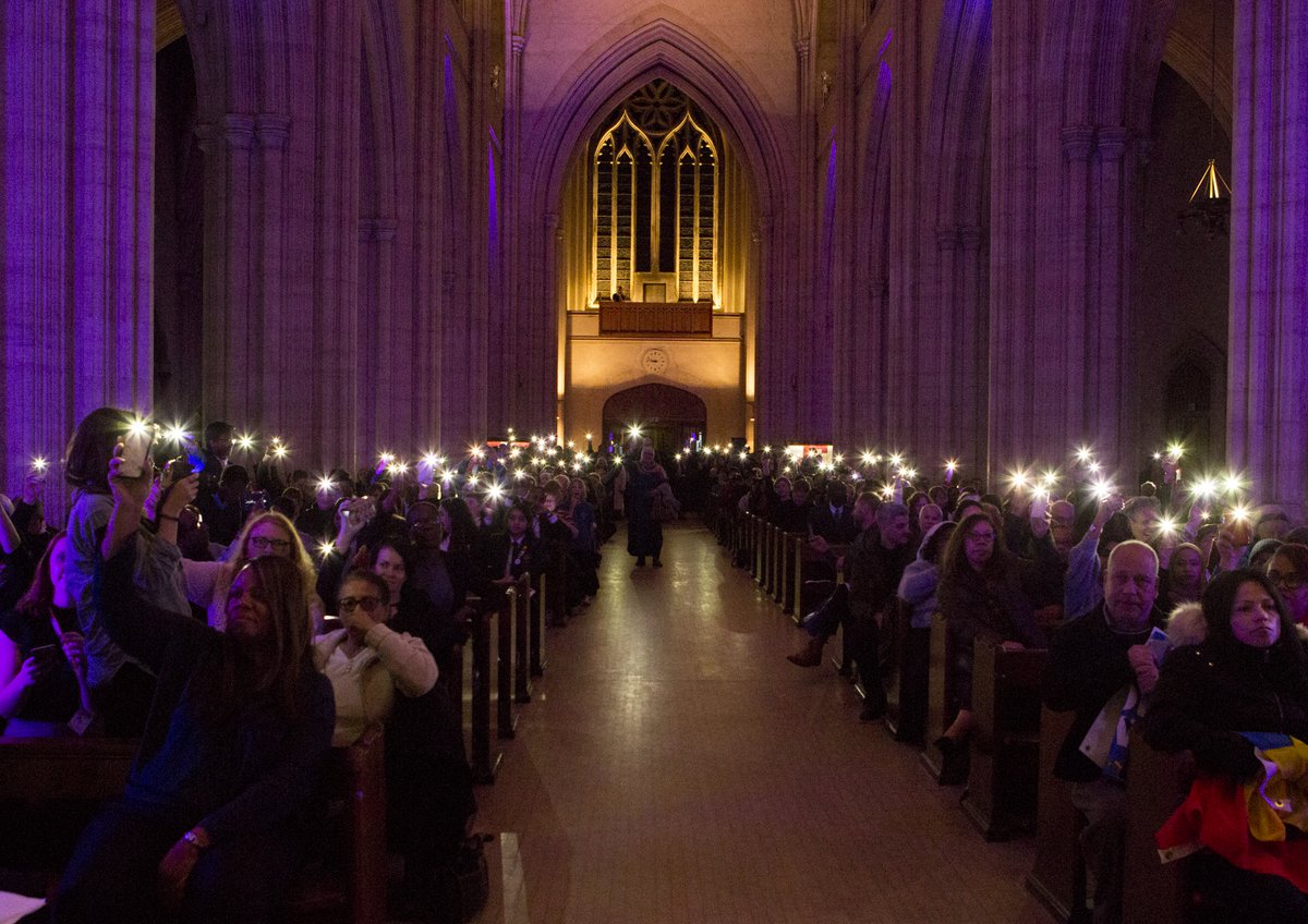 Phone lit faith group gathering