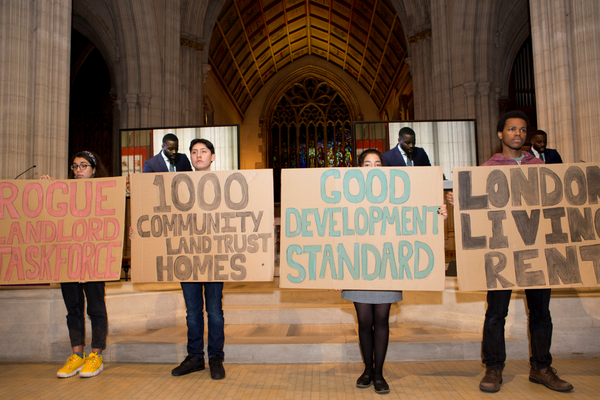 Citizens UK leaders, affordable housing action, holding signs reading "Rogue Landlord Taskforce, 1000 Community Land trust Homes, Good development standard, London living rent"