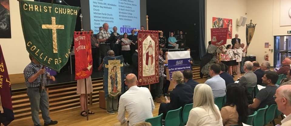 Different membership organisations holding their flags