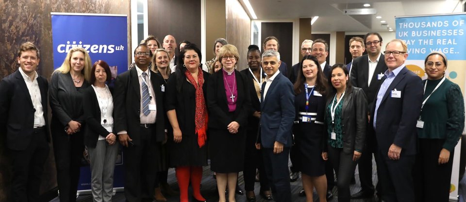 Members of the Make London a Living Wage City steering group posing, including Katherine Chapman, Director of the Living Wage Foundation, and Mayor of London Sadiq Khan.